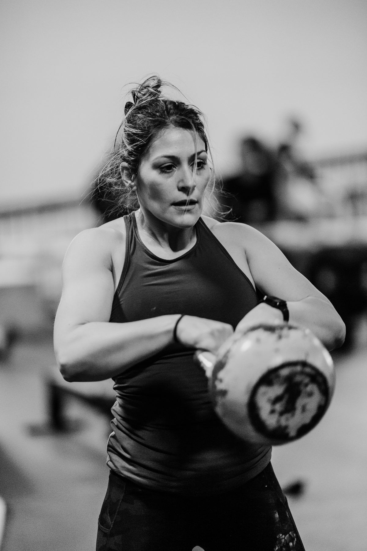 Member swinging a kettlebell
