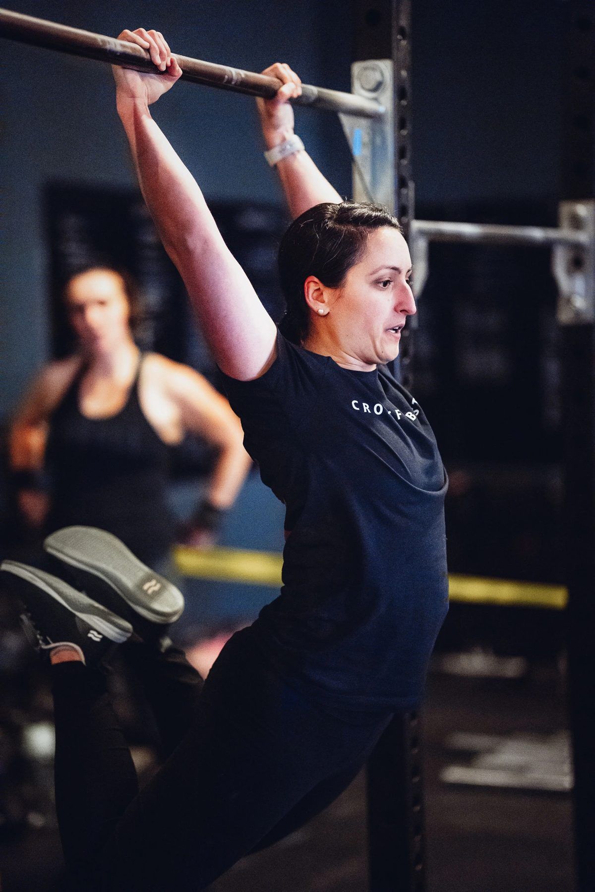 Boston Iron Grit member performing kipping pull-ups
